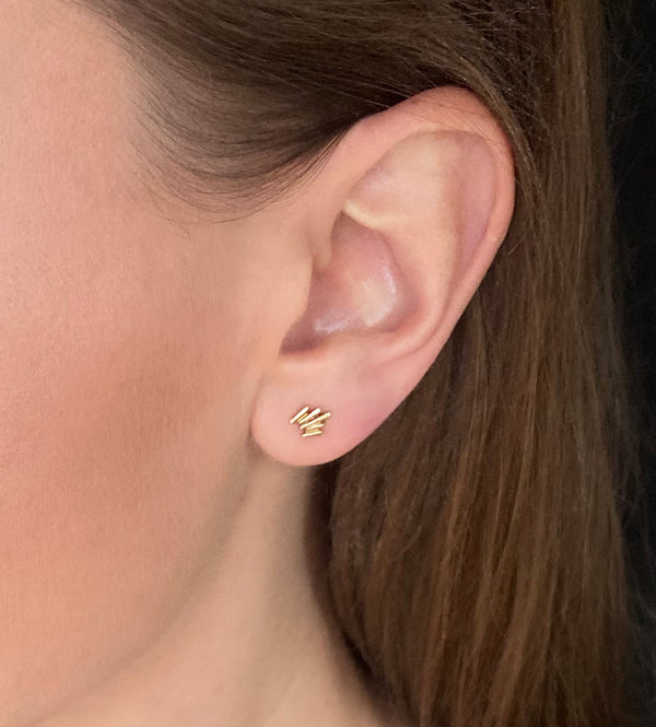 Unique, gold vermeil stud earrings, modeled