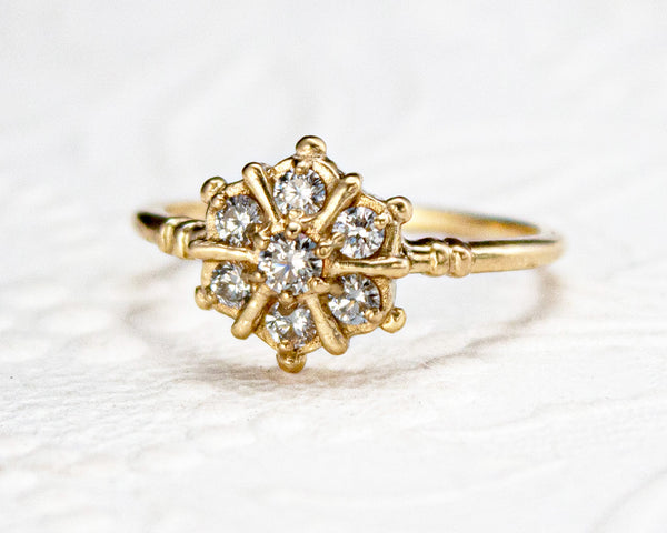 Snowflake inspired diamond cluster ring, front view