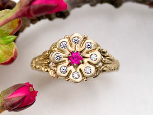 Vintage style, flower engagement ring front view with blue sapphire