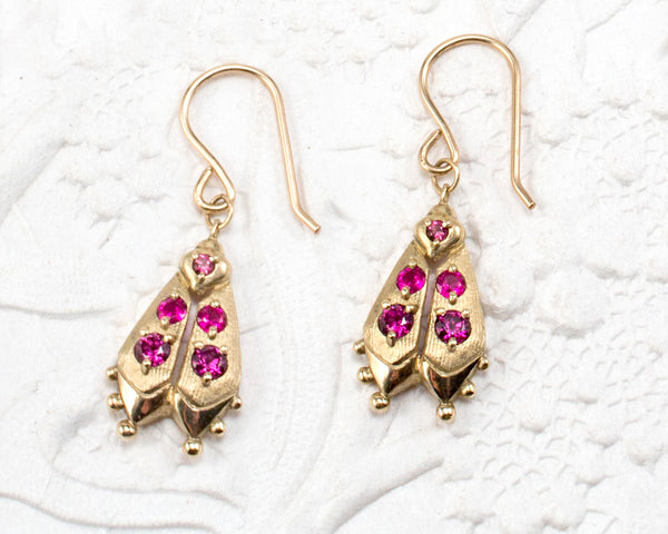 Handmade firefly jewelry in solid gold with pink gemstones