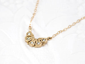 dainty 14k gold necklace, with five diamonds