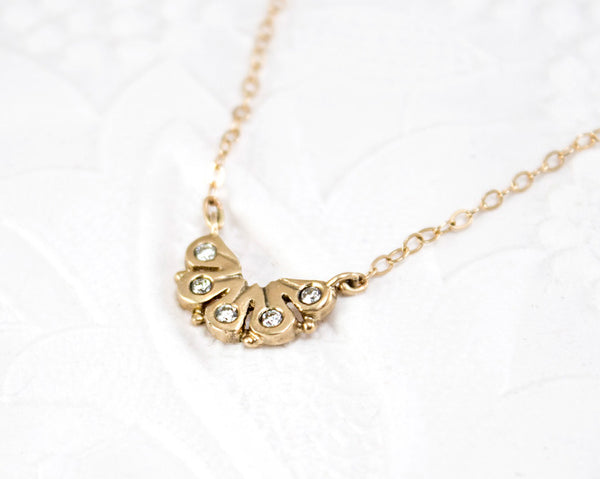 dainty 14k gold necklace, with five diamonds