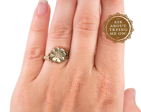 Vintage style flower ring with a diamond center, modeled