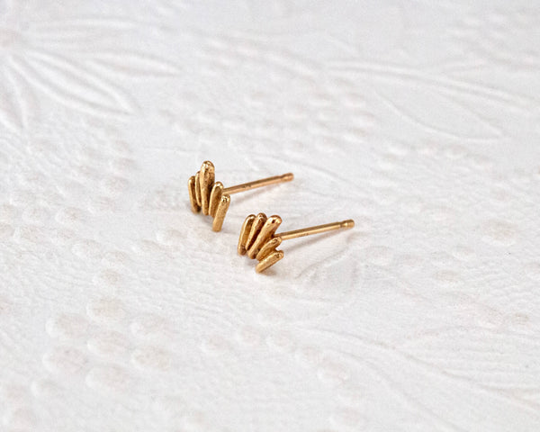 Unique, gold stud earrings, top view