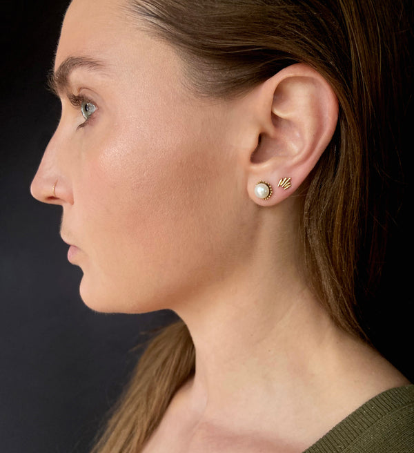 small gold stud earrings, modeled