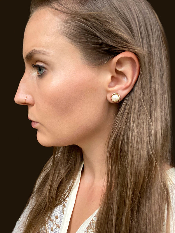 Handmade, gold pearl stud earrings, modeled