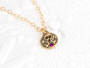 Small skull and crossbones necklace, solid gold