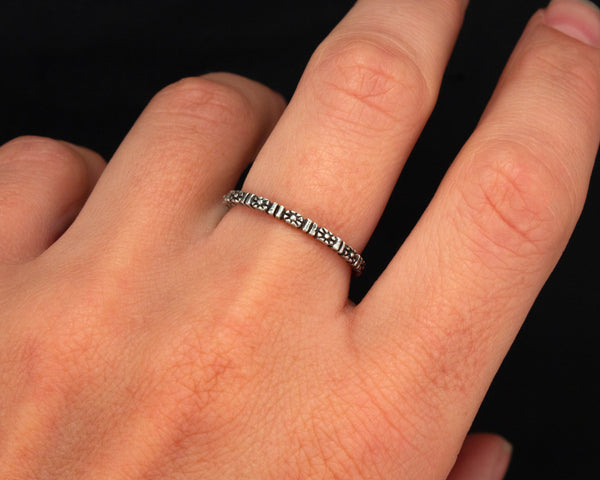 Sterling silver flower eternity band, modeled
