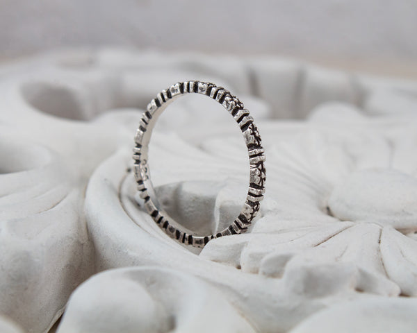 Sterling silver flower eternity band, side view