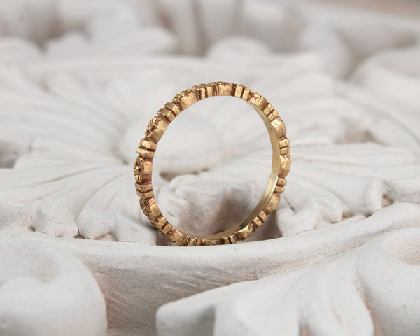 Gold floral wedding band, eternity style side view