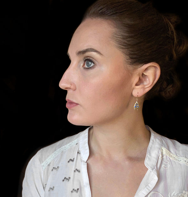 Handmade firefly jewelry, solid gold earrings with colorful gemstones modeled