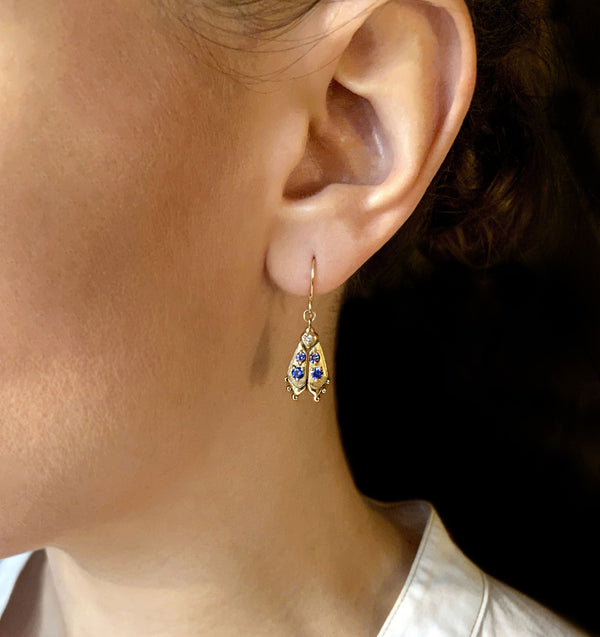 Handmade firefly jewelry, solid gold earrings with colorful gemstones, modeled
