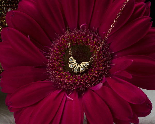 dainty 14k gold necklace, with five diamonds