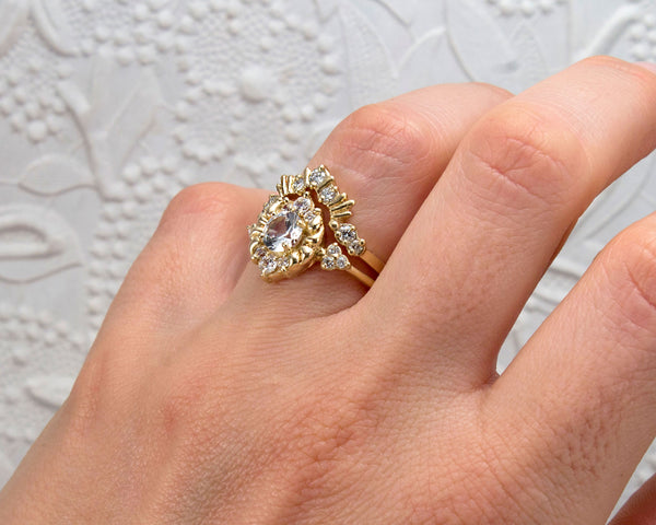 Unique, vintage style engagement ring modeled with band