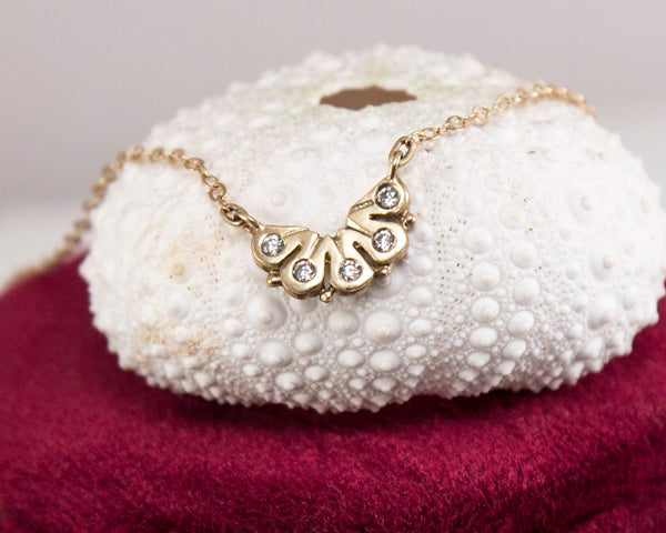 dainty 14k gold necklace, with five diamonds