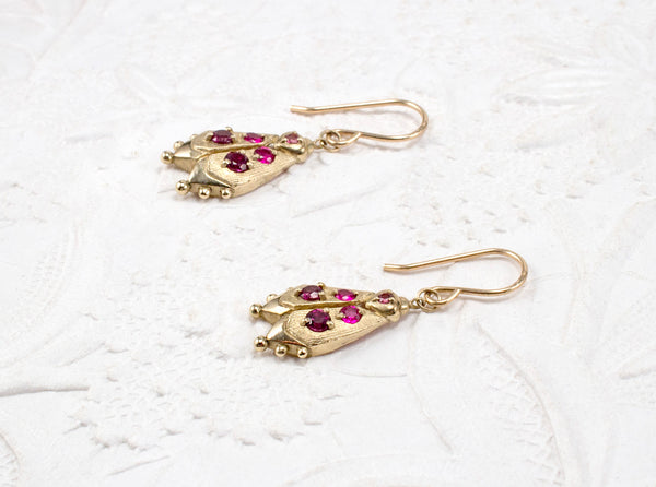 Handmade firefly jewelry, solid gold earrings with pink gemstones, side view