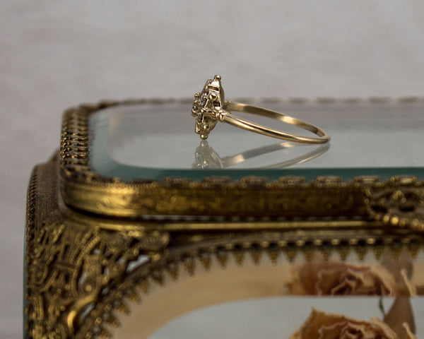 diamond cluster ring, side view
