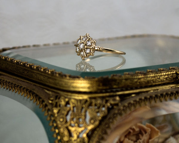 Snowflake inspired diamond cluster ring
