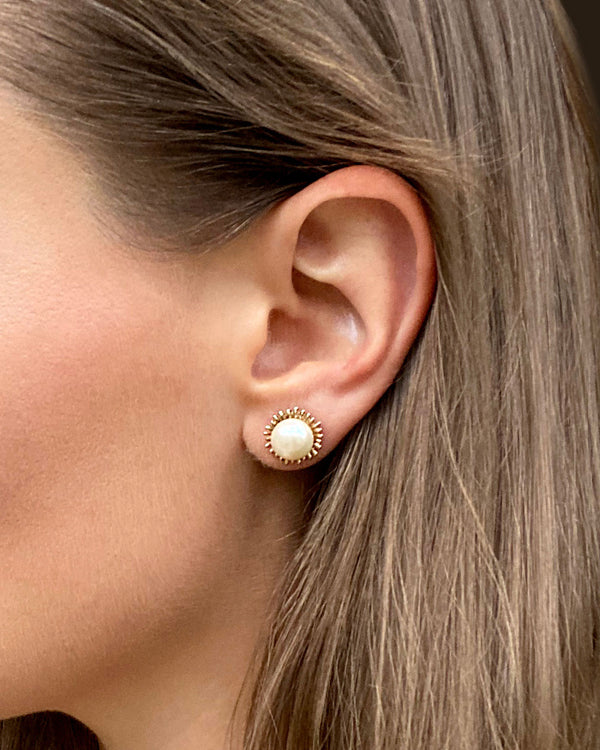 Handmade, gold pearl stud earrings, modeled