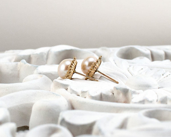 Handmade, gold pearl stud earrings, side view