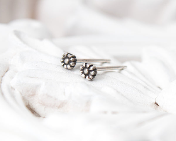 Small, tiny daisy flower stud earrings in sterling silver