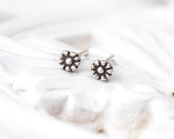 Small, tiny daisy flower stud earrings in sterling silver