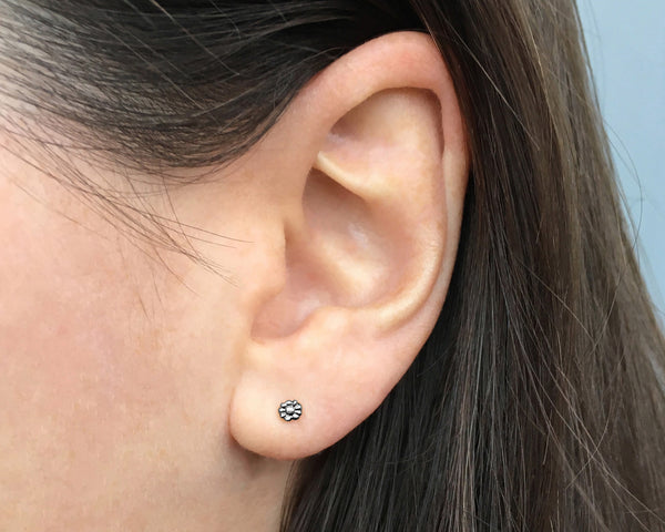 Small, tiny daisy flower stud earrings in sterling silver