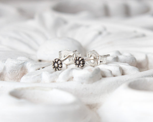 Small, tiny daisy flower stud earrings in sterling silver