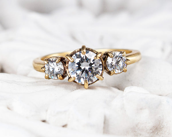 Handcrafted, three stone engagement ring