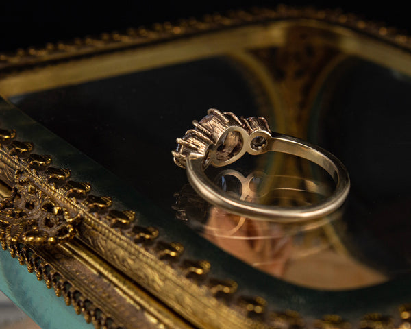 Handcrafted, three stone engagement ring