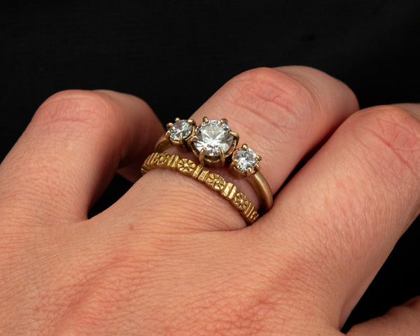 Handcrafted, three stone engagement ring