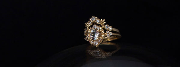 Unique, antique style engagement ring with a crown style wedding ring