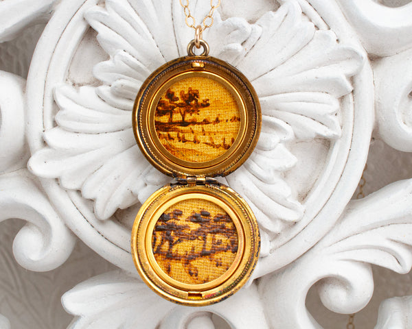 Vintage locket necklace with landscape paintings