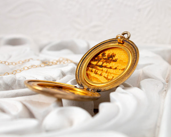 Vintage locket necklace with landscape paintings