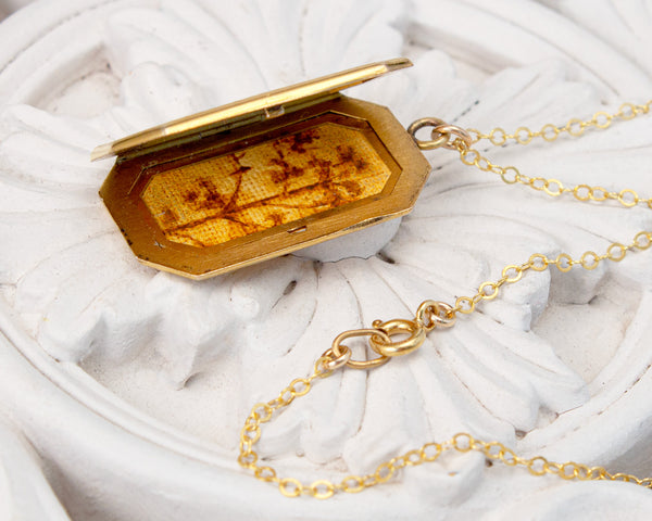 Vintage locket with tree and bird painting