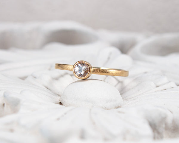 white sapphire bezel ring