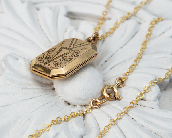 Vintage locket with bird painting