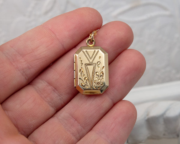 Front of Vintage locket with bird painting