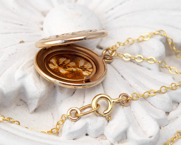 vintage locket with wildflower painting
