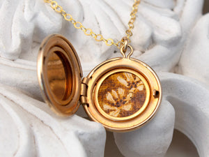 vintage locket with wildflower painting
