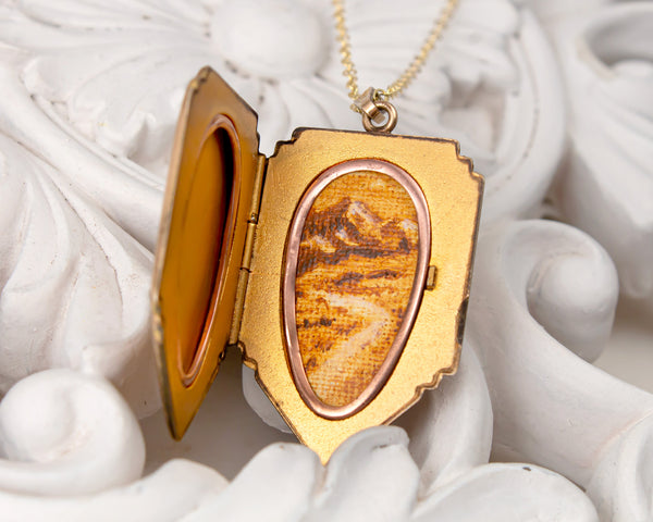 Vintage gold locket necklace with mountains