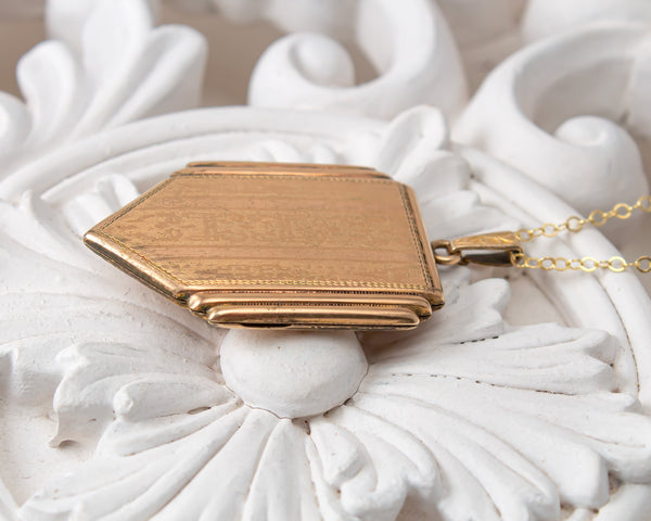 Vintage gold locket necklace with mountains