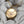 Front of Small, round vintage locket with dog