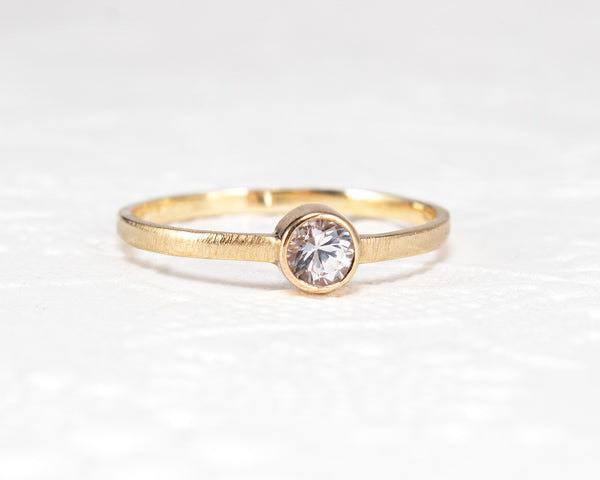 white sapphire bezel ring