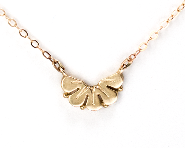 Nature-inspired gold petal necklace