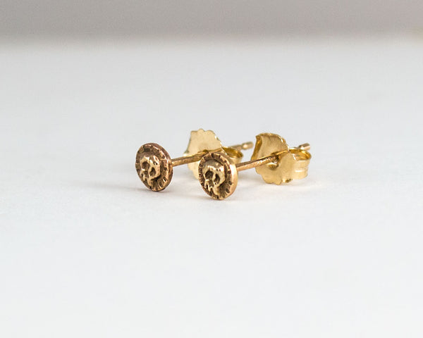 Small skull stud earrings, solid gold