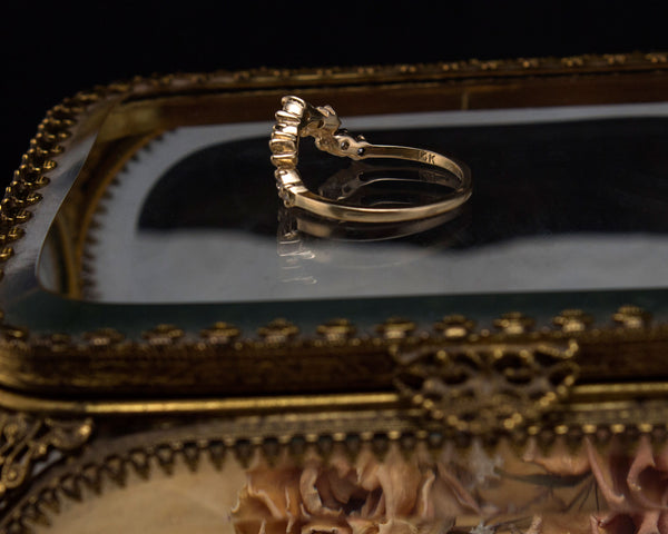 Side view of a tiara wedding ring