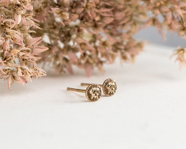 Small skull stud earrings, solid gold